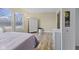 Bedroom featuring hardwood floors, 2 windows, and neutral-toned walls at 11614 Presidio Dr, Indianapolis, IN 46235