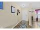 Inviting entryway with decorative rug and coat rack at 11614 Presidio Dr, Indianapolis, IN 46235