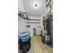 Laundry room featuring a washer, dryer, water heater, and storage space at 11614 Presidio Dr, Indianapolis, IN 46235