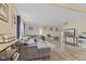 Bright living area showcasing wood-like floors, large sectional, and decor at 11614 Presidio Dr, Indianapolis, IN 46235