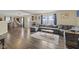Spacious living room with a large sectional couch and wood-like flooring at 11614 Presidio Dr, Indianapolis, IN 46235