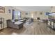 Large living room features a comfortable sectional and wood-like floors at 11614 Presidio Dr, Indianapolis, IN 46235