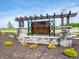 Decorative community sign for Brunson's Landing with stone base and pergola top at 1346 Fleming Dr, Greenfield, IN 46140