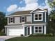 Charming two-story home featuring blue siding, shaker accents, white trim, and a two-car garage at 1346 Fleming Dr, Greenfield, IN 46140