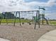 Community playground featuring swings and slides set in a common park area at 1346 Fleming Dr, Greenfield, IN 46140
