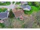 A view from above shows a home with multi-level decks and a backdrop of mature trees at 13841 Waywing Ct, Carmel, IN 46033