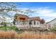 Expansive backyard featuring a spacious deck with a charming pergola for outdoor enjoyment at 13841 Waywing Ct, Carmel, IN 46033