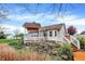 Landscaped backyard featuring a spacious deck with a charming pergola and stone accents at 13841 Waywing Ct, Carmel, IN 46033