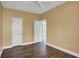 A simple bedroom with hardwood floors, neutral walls, and natural light at 13841 Waywing Ct, Carmel, IN 46033