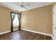 A bright, airy bedroom featuring hardwood floors, neutral walls, and natural light at 13841 Waywing Ct, Carmel, IN 46033