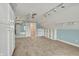 Bonus room featuring carpeted floors, ceiling fan, track lighting, and custom shelving at 13841 Waywing Ct, Carmel, IN 46033