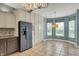Charming breakfast nook with modern appliances, tile floors, and cabinet space at 13841 Waywing Ct, Carmel, IN 46033