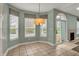 Bright breakfast nook with large windows and sliding door to outdoor space at 13841 Waywing Ct, Carmel, IN 46033