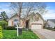 Inviting home with a well-manicured lawn and a classic, timeless design at 13841 Waywing Ct, Carmel, IN 46033
