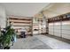 Spacious garage featuring open shelving for storage and ample room for vehicles and projects at 13841 Waywing Ct, Carmel, IN 46033