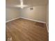 Spacious basement with wooden floor, light and AC unit at 1425 W 9Th St, Anderson, IN 46016