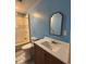 Bathroom featuring a tub, shower, sink, and toilet at 1425 W 9Th St, Anderson, IN 46016