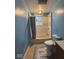 Bathroom featuring a tub, shower, toilet, and updated tile at 1425 W 9Th St, Anderson, IN 46016