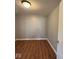 This bedroom features attractive wood flooring and neutral gray walls, providing a blank canvas for personalization at 1425 W 9Th St, Anderson, IN 46016