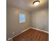 The bedroom boasts a window that provides natural light and nice wood-look flooring at 1425 W 9Th St, Anderson, IN 46016