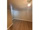 This bedroom features attractive wood flooring and neutral walls at 1425 W 9Th St, Anderson, IN 46016