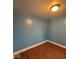 This bedroom features attractive wood flooring and bright blue walls at 1425 W 9Th St, Anderson, IN 46016