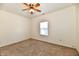 Neutral bedroom with carpeted floor, ceiling fan, and window providing natural light at 1507 Park Dr, Lebanon, IN 46052