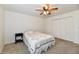Bright bedroom featuring carpeted floors, ceiling fan, and double door closet at 1507 Park Dr, Lebanon, IN 46052