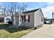 Charming single-story home featuring gray siding, a gray roof, and well-maintained landscaping at 1507 Park Dr, Lebanon, IN 46052