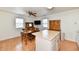 Cozy kitchen with wooden cabinets, kitchen island, and adjacent dining area at 1507 Park Dr, Lebanon, IN 46052
