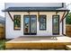 Backyard deck featuring black trim windows and wood beams at 1526 Laurel St, Indianapolis, IN 46203