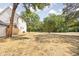 Large grassy backyard, surrounded by mature trees, providing a serene and private outdoor space at 1526 Laurel St, Indianapolis, IN 46203