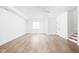 Large basement featuring light hardwood floors and white walls at 1526 Laurel St, Indianapolis, IN 46203