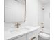 Bathroom featuring marble counters, a large mirror, and modern bronze fixtures at 1526 Laurel St, Indianapolis, IN 46203