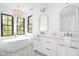 Elegant bathroom with a double sink vanity, decorative tile floor, and natural light at 1526 Laurel St, Indianapolis, IN 46203