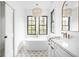 A luxurious bathroom with a freestanding tub, marble counters, and designer lighting at 1526 Laurel St, Indianapolis, IN 46203
