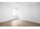 Bright bedroom featuring light hardwood floors and a window providing natural light at 1526 Laurel St, Indianapolis, IN 46203