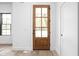 Bright entryway with wood door, white walls, and wood floors at 1526 Laurel St, Indianapolis, IN 46203