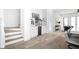 Hallway showcasing stylish flooring and stairs with integrated wine storage beneath at 1526 Laurel St, Indianapolis, IN 46203