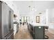 Well-lit kitchen with large island, stainless steel appliances, and open layout to dining area at 1526 Laurel St, Indianapolis, IN 46203