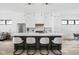 Modern kitchen featuring an island with bar seating, stainless steel appliances and pendant lighting at 1526 Laurel St, Indianapolis, IN 46203