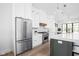 Bright kitchen with stainless steel appliances, custom cabinets, and a center island with pendant lighting at 1526 Laurel St, Indianapolis, IN 46203