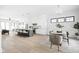 Open-concept kitchen with island seating, stainless steel appliances, and hardwood floors at 1526 Laurel St, Indianapolis, IN 46203