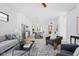 Open-concept living space with hardwood floors, modern furnishings, and seamless flow to the gourmet kitchen at 1526 Laurel St, Indianapolis, IN 46203
