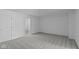 Neutral bedroom with modern carpet, white walls, and ensuite bathroom at 16771 Cattle Hollow Ln, Noblesville, IN 46060