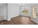 Dining room with wood floors, modern chandelier and natural light at 16771 Cattle Hollow Ln, Noblesville, IN 46060