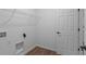 Efficient laundry room offers convenient shelving, modern hookups, and a clean, organized space at 16771 Cattle Hollow Ln, Noblesville, IN 46060