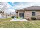 The backyard includes a patio and outdoor furniture near the brick house at 18357 Piers End Dr, Noblesville, IN 46062