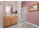 This bathroom features a wood vanity with a cream sink, mirror, and a glass shower behind sliding doors at 18357 Piers End Dr, Noblesville, IN 46062