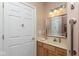 Bathroom features a light wood vanity cabinet with a cream colored sink, and a silver framed mirror at 18357 Piers End Dr, Noblesville, IN 46062